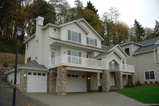 Two-story home with wraparound DeckRite vinyl porches and decks