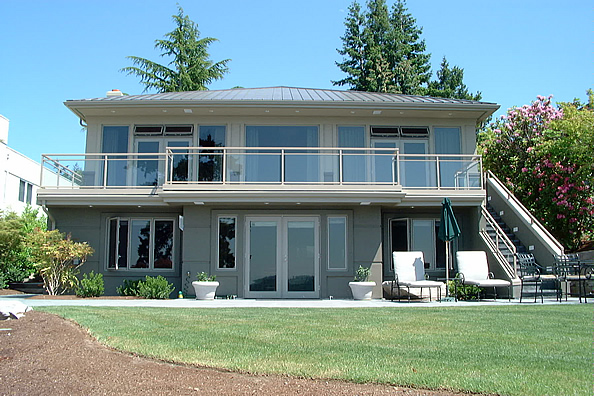 Modern lakefront home with upper and lower DeckRite vinyl decks