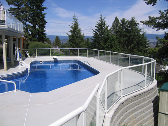 Curved swimming pool surrounded by DeckRite vinyl decking