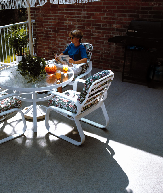 Covered residential deck with dining furniture on DeckRite vinyl
