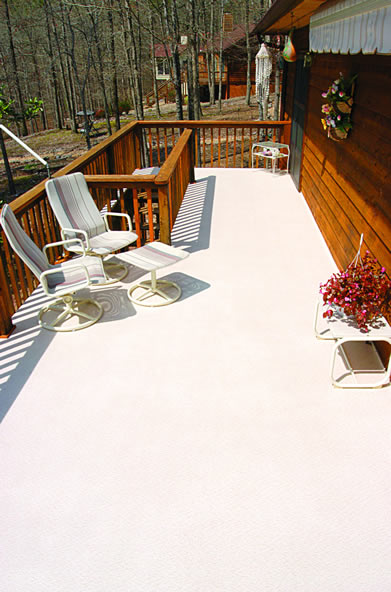 Rooftop DeckRite vinyl deck with lounge chairs and a city view