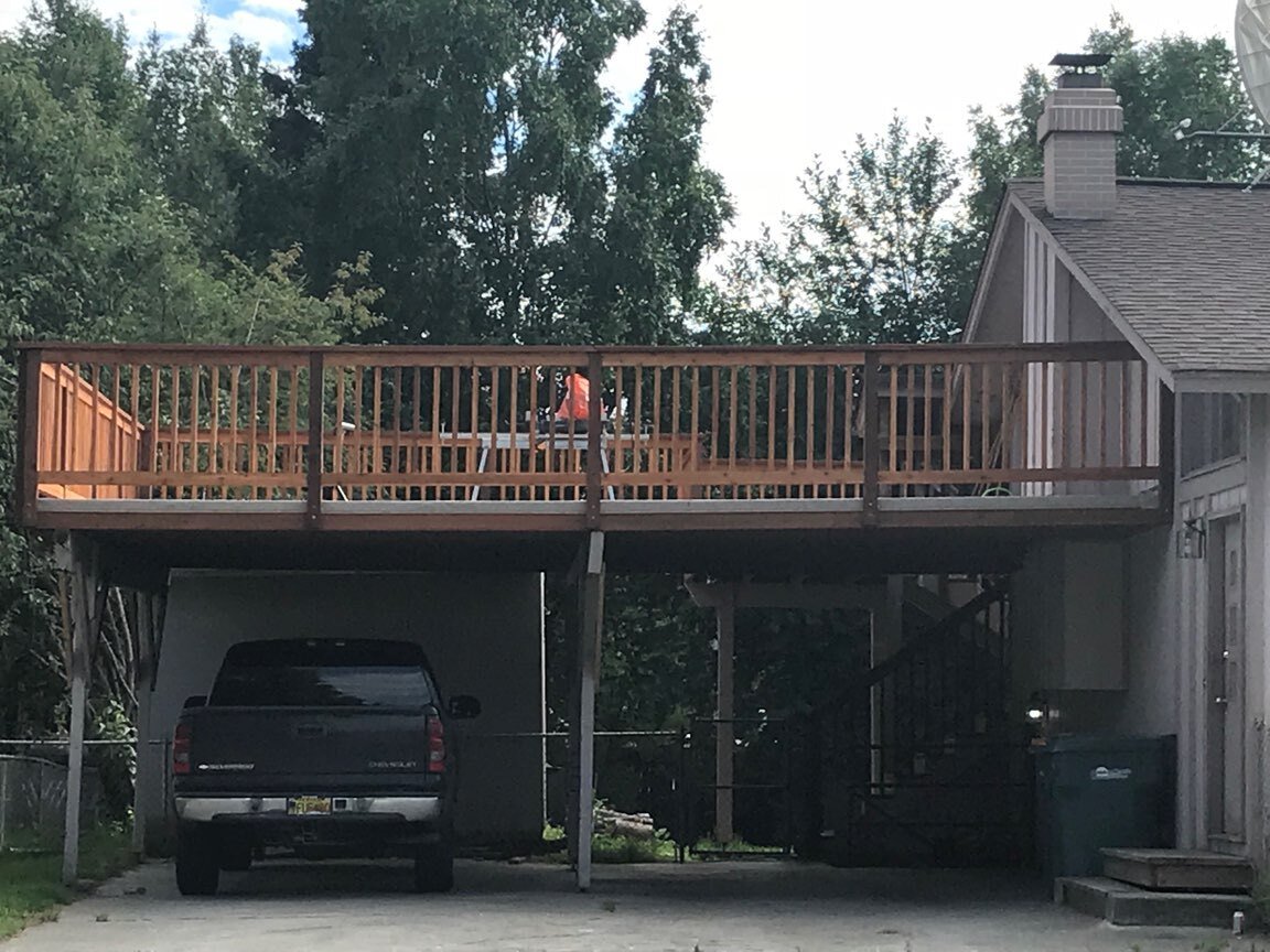 Elevated vinyl deck over a driveway in Anchorage