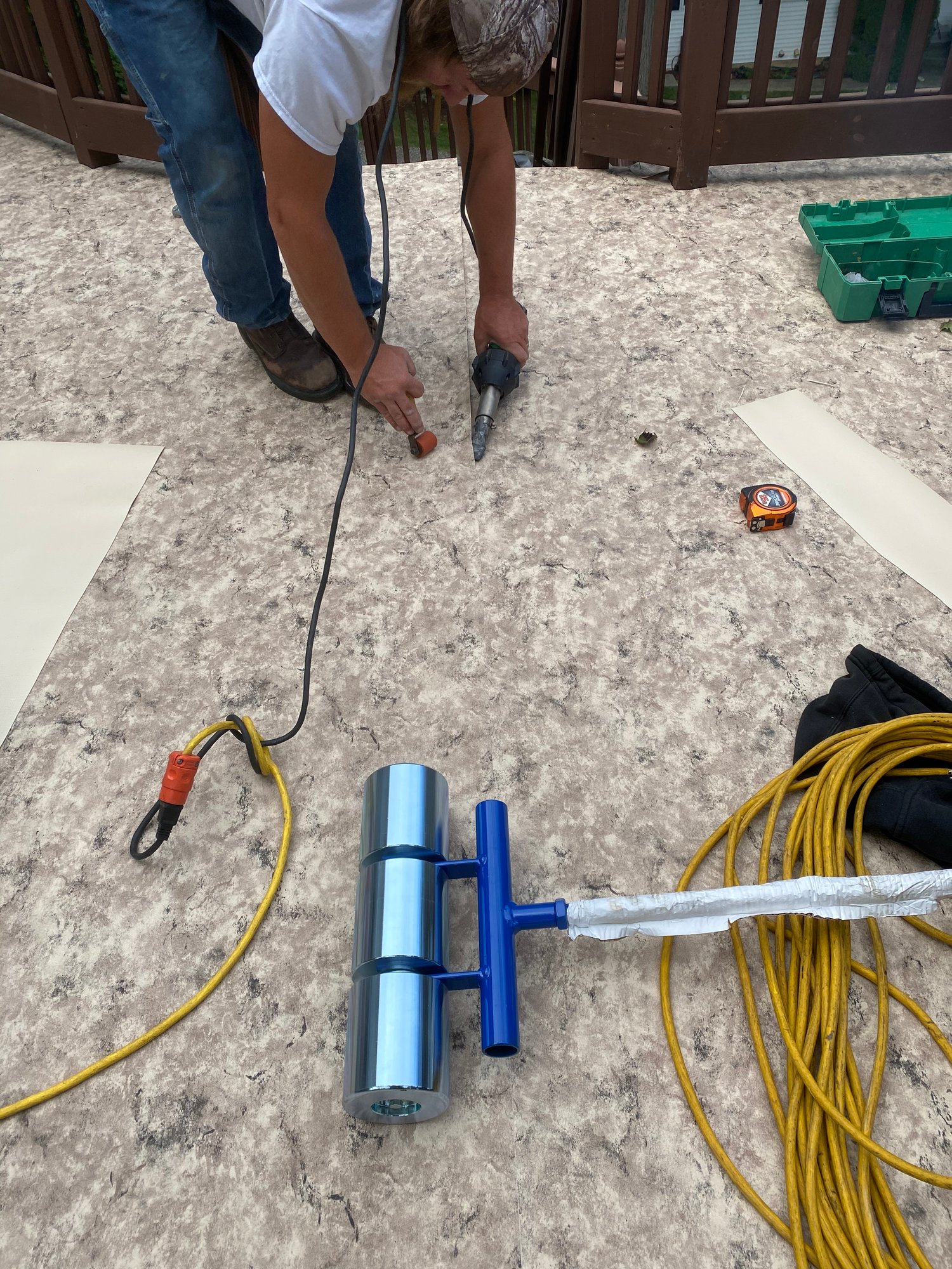 Hot-air welding Tuscany Sand vinyl on a Michigan deck