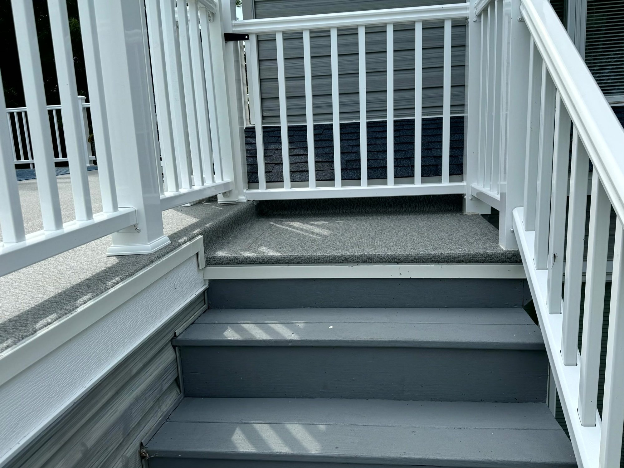 Vinyl-covered stair landing in Sand Pointe, Michigan